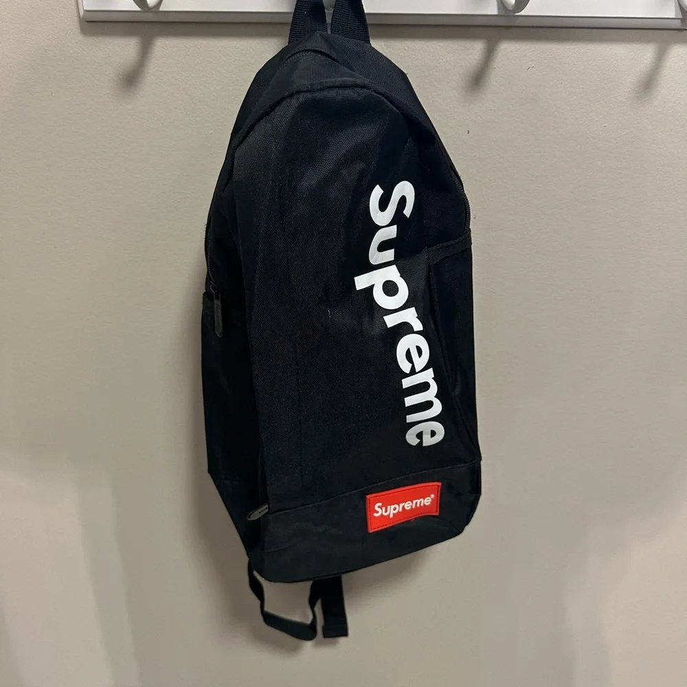 Supreme Black Backpack with White Logo and Red Patch